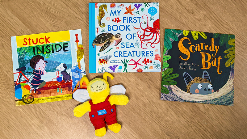A small Bookbug soft toy beside the Bookbug Picture Book Prize shortlist for 2023
